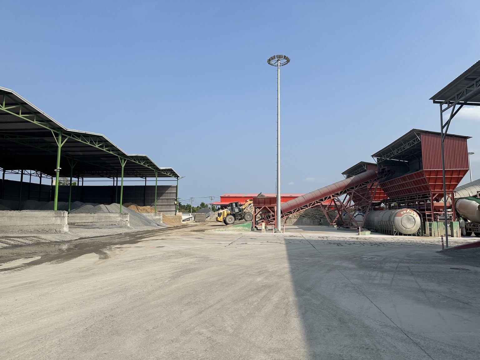 Aggregate yard and conveyor area at Long Duc concrete plant