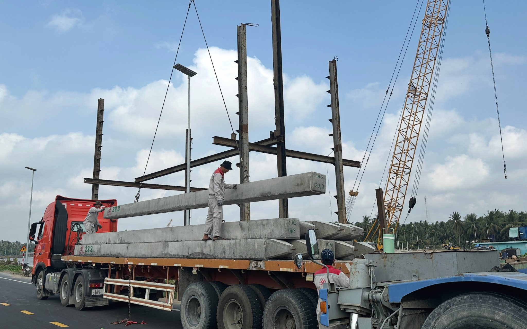 Pile handling and loading activity at Lang The freshwater lake project