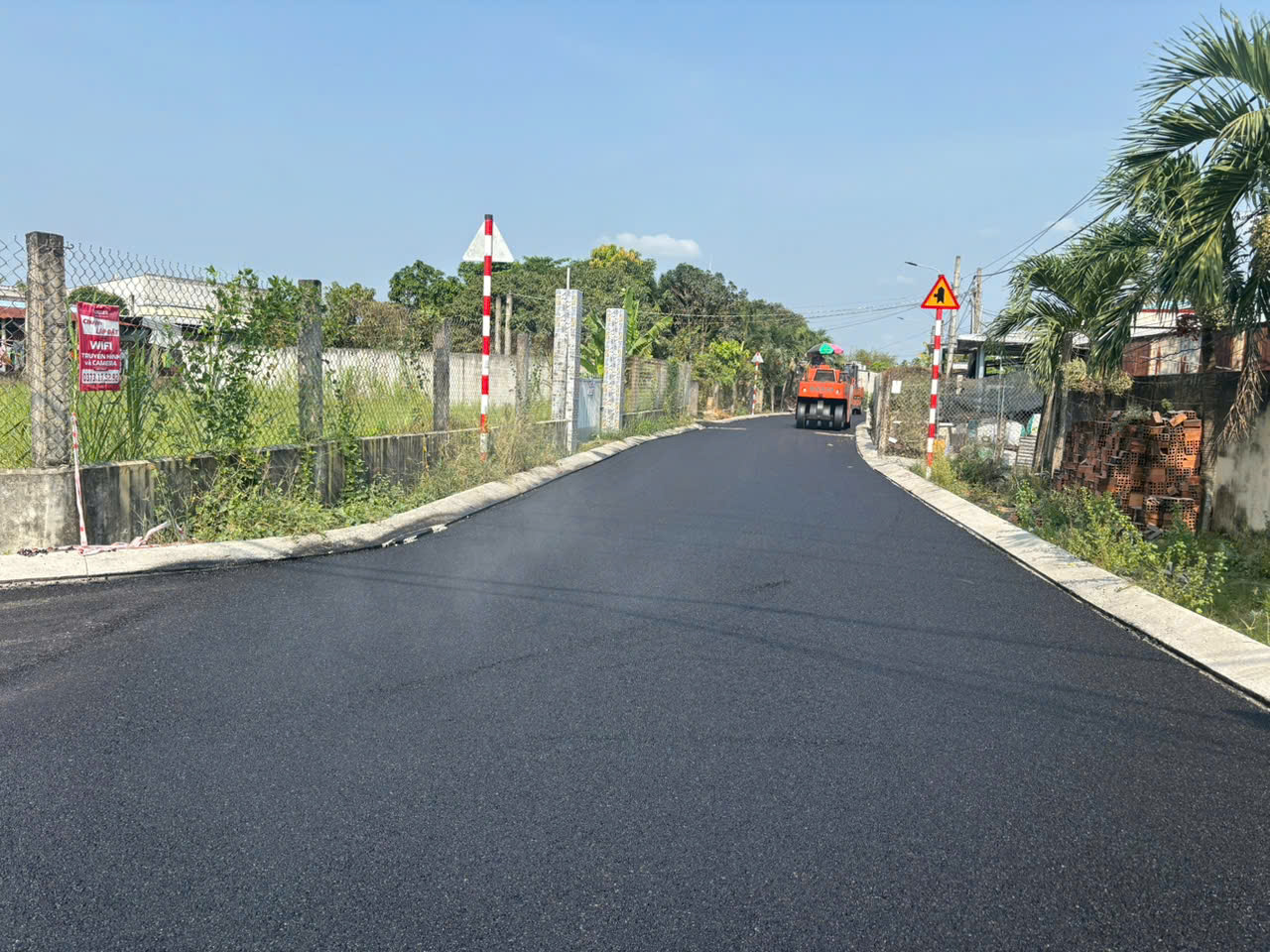Freshly finished asphalt road delivered by Long Duc